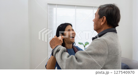 Holding hands, hug or happy old couple dancing for love, support or trust in marriage at home together 127540970