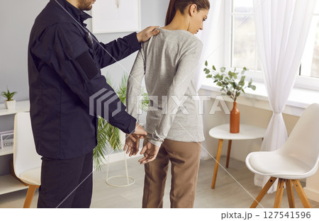 Policeman Handcuffing Guilty Woman And Arresting Her Policeman Handcuffing Guilty Woman And Arresting Her 127541596