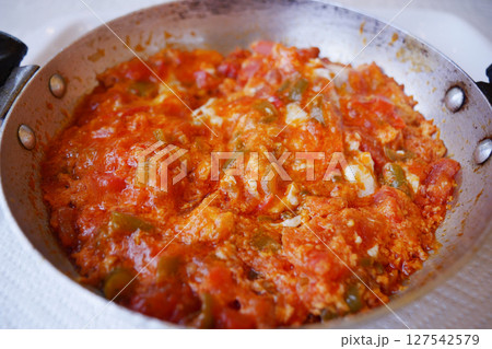 Turkish Menemen omelet in a frying pan. . Turkish Menemen omelet in a frying pan. . 127542579