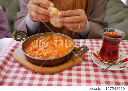 Turkish Menemen omelet in a frying pan. . Turkish Menemen omelet in a frying pan. . 127542660