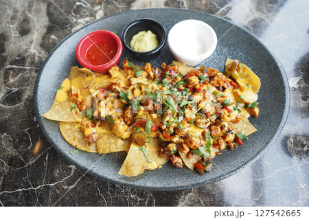 Corn chips nachos with fried minced meat Corn chips nachos with fried minced meat 127542665