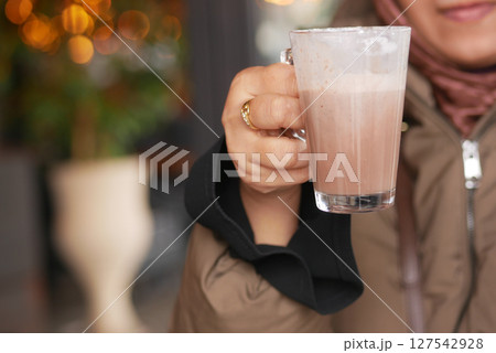 Warm beverage enjoyed in cozy cafe atmosphere 127542928