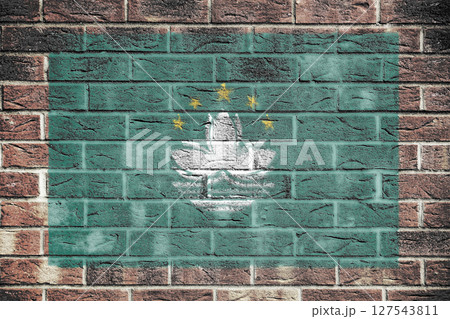 Macao flag on brick wall background 127543811