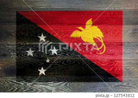 Papua new guinea flag on rustic old wood surface background 127543812