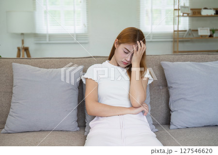 Woman has headache dizzy, holding her head in his hands because had headache and burning temperature Woman has headache dizzy, holding her head in his hands because had headache and burning temperature 127546620