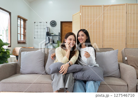 gay couple hug on sofa to relax together in healthy relationship love connection. Lgbtq couple concept 127546710