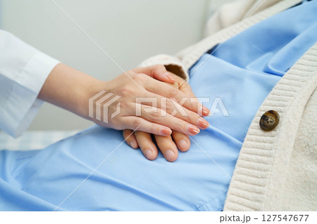 Asian doctor checking and treat elderly woman patient health in hospital. Asian doctor checking and treat elderly woman patient health in hospital. 127547677