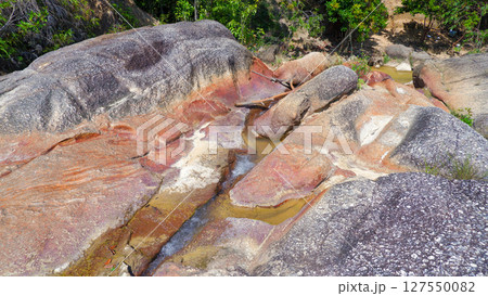 Vibrant Reddish Rock Formations with Shallow Water Pools in Palembang 127550082