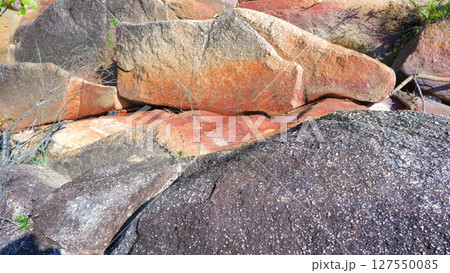 Rocky Stream with Smooth Granite Slopes and Lush Tropical Forest in Muntok 127550085