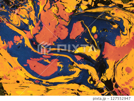 Moody dark blue and fiery gold fluid swirls form a dramatic marble pattern, perfect for intense contemporary backgrounds or energetic design themes 127552947