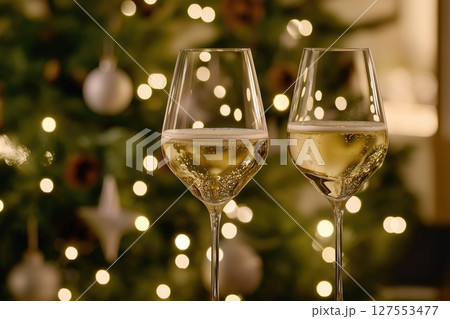 Celebration Captured in Glimmering Glasses of Champagne Amidst a Warm Glow of Bokeh Lights 127553477