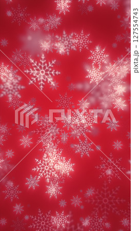 Festive red background with delicate white snowflakes falling in soft focus 127554743