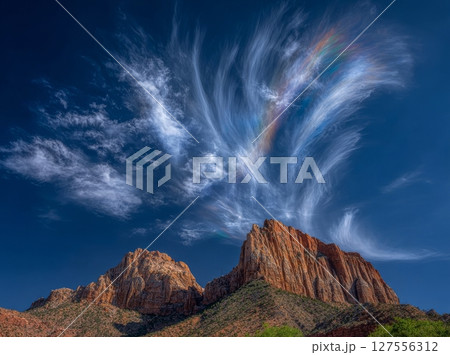 The landscape of Zion National Park in the USA features red rocks set against a blue sky 127556312