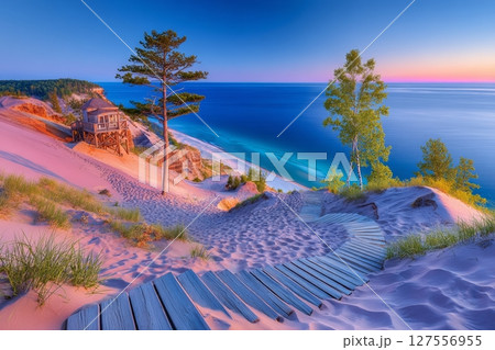 The Pierce Stocking Scenic Drive in Michigan features a summer sunset over Lake Michigan, with massive sand dunes and a scenic overlook within the Sleeping Bear Dunes National Lakeshore 127556955