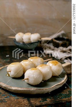 Japanese Dango Dumplings on Wooden Plate 127559002