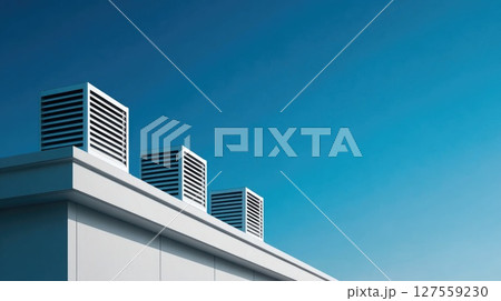 Modern Rooftop Ventilation Units Against Blue Sky Modern Rooftop Ventilation Units Against Blue Sky 127559230