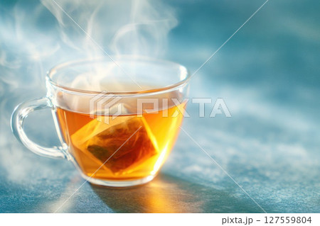 Hot Herbal Tea in Glass Cup with Steam 127559804