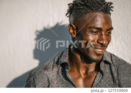 Man Smiling in Patterned Shirt 127559909