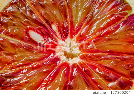 Bloody red orange kara-kara, cut lobule sectors close-up macro, top view 127560204