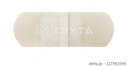 Medical band-aid, flesh-colored strip, antibacterial, inner  part, with protective film, isolated on white background with clipping path 127561048