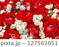 Flowers red roses buds and small white in bouquet, close-up selective focus 127561051
