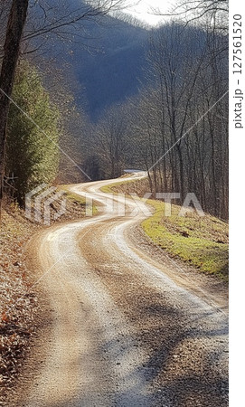 Long winding country road leading into the mountains. Long winding country road leading into the mountains. 127561520