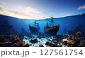 夕焼けに染まる海、深海に沈む難破船 127561754