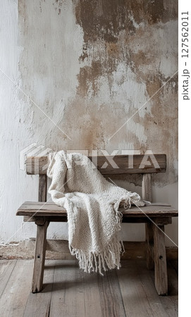 soft throw spilling off rustic wooden bench. soft throw spilling off rustic wooden bench. 127562011