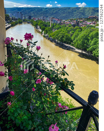 Panoramic view of the Kura river from a balcony with roses in Tbilisi. High quality photo Panoramic view of the Kura river from a balcony with roses in Tbilisi. High quality photo 127562244