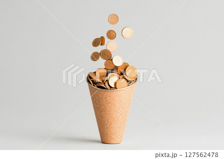 Hands pouring coins into a funnel leading to public infrastructure projects, symbolizing government spending, public investment, fiscal allocation 127562478