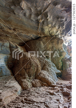 Interior of a famous cave with its rocky formations 127563015