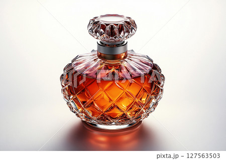 Perfume bottle with glossy on its glass surface, conveying elegance and sophistication. Ideal for high-end perfume advertisements. 127563503