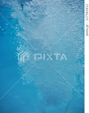 A splash of water in a pool A splash of water in a pool 127563812