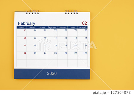 February 2026 desk calendar on the yellow table, planning for business meeting or planning concept. February 2026 desk calendar on the yellow table, planning for business meeting or planning concept. 127564078