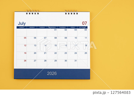 July 2026 desk calendar on the yellow table, planning for business meeting or planning concept. 127564083