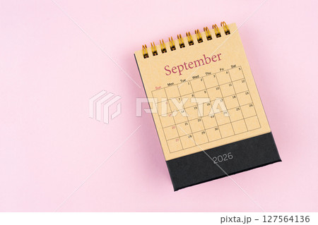 September 2026 desk calendar on pink color background, Position with copy space. Flat lay. September 2026 desk calendar on pink color background, Position with copy space. Flat lay. 127564136