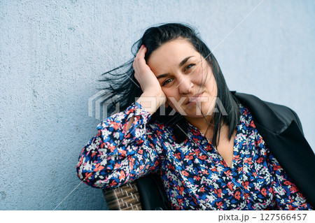 Confident Black Businesswoman Taking a Break on Terrace of Her Company 127566457