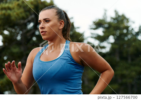 Unstoppable: A Determined Athlete Trains Through the Rain in Pursuit of Marathon Glory Unstoppable: A Determined Athlete Trains Through the Rain in Pursuit of Marathon Glory 127566700