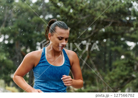 Unstoppable: A Determined Athlete Trains Through the Rain in Pursuit of Marathon Glory Unstoppable: A Determined Athlete Trains Through the Rain in Pursuit of Marathon Glory 127566702