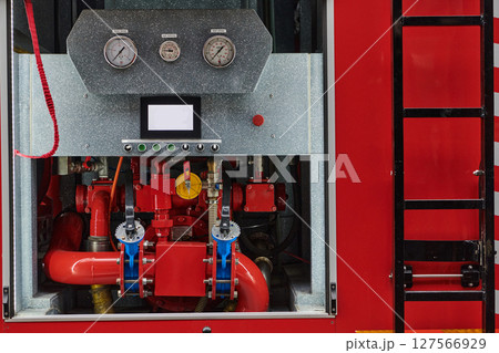 Close-up of essential firefighting equipment on a modern firetruck, showcasing tools and gear ready for emergency response to hazardous fire situations Close-up of essential firefighting equipment on a modern firetruck, showcasing tools and gear ready for emergency response to hazardous fire situations 127566929