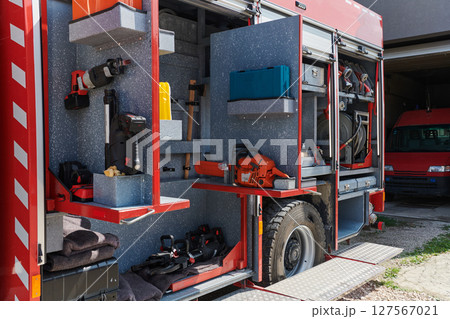 Close-up of essential firefighting equipment on a modern firetruck, showcasing tools and gear ready for emergency response to hazardous fire situations 127567021