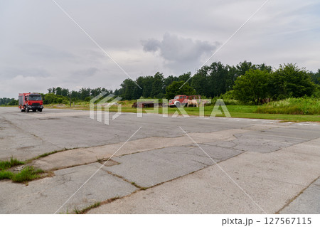 In this captivating scene, a state-of-the-art firetruck, equipped with advanced rescue technology, stands ready with its skilled firefighting team, prepared to intervene and respond rapidly to In this captivating scene, a state-of-the-art firetruck, equipped with advanced rescue technology, stands ready with its skilled firefighting team, prepared to intervene and respond rapidly to 127567115