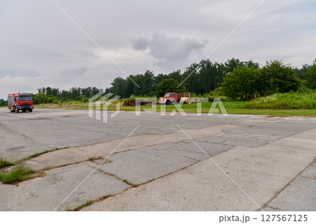 In this captivating scene, a state-of-the-art firetruck, equipped with advanced rescue technology, stands ready with its skilled firefighting team, prepared to intervene and respond rapidly to In this captivating scene, a state-of-the-art firetruck, equipped with advanced rescue technology, stands ready with its skilled firefighting team, prepared to intervene and respond rapidly to 127567125