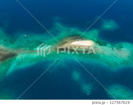 Tropical white sandbar surrounded by deep blue sea. Naked Island. Seascape. Mindanao, Philippines. Tropical white sandbar surrounded by deep blue sea. Naked Island. Seascape. Mindanao, Philippines. 127567629
