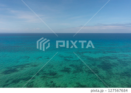 Sea surface with corals in Bantayan, Cebu. Philippines. Seascape with turquoise sea water. Sea surface with corals in Bantayan, Cebu. Philippines. Seascape with turquoise sea water. 127567684