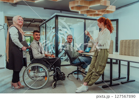 Young group of business people brainstorming together in a startup space, discussing business projects, investments, and solving challenges. 127567890