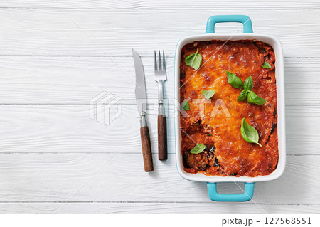 Eggplant Parmigiana in a baking dish, top view 127568551