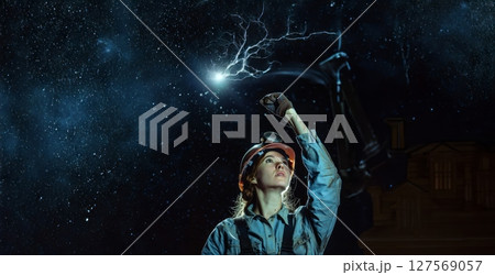 Woman Miner in Protective Gear Reaching for Light in Dark Mine.Generated image 127569057