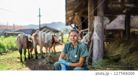 Smiling Young Female Veterinarian in Uniform Caring for Animals on Farm.Generated image 127569200