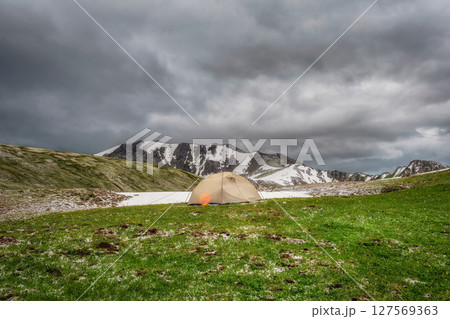 Awesome mountain scenery with tent. Awesome mountain scenery with tent. 127569363